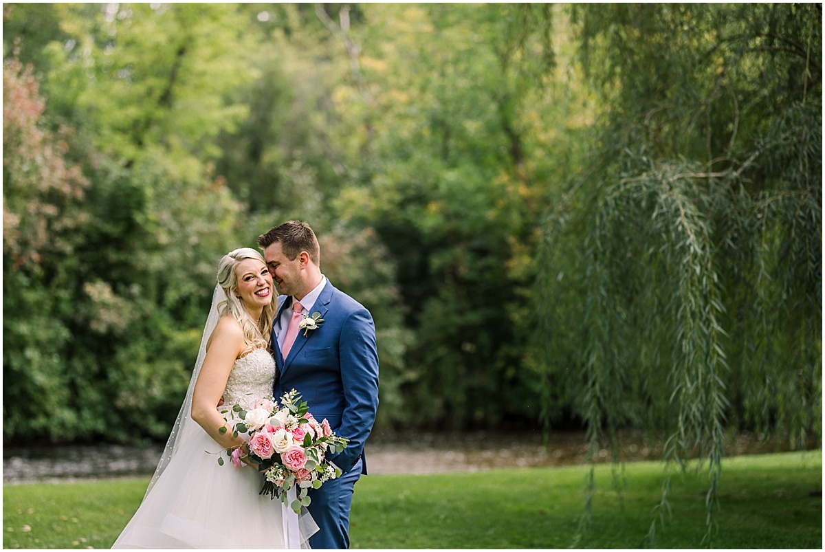 Creekside Farm Minneapolis Minnesota joyful and happy bride and groom by creek