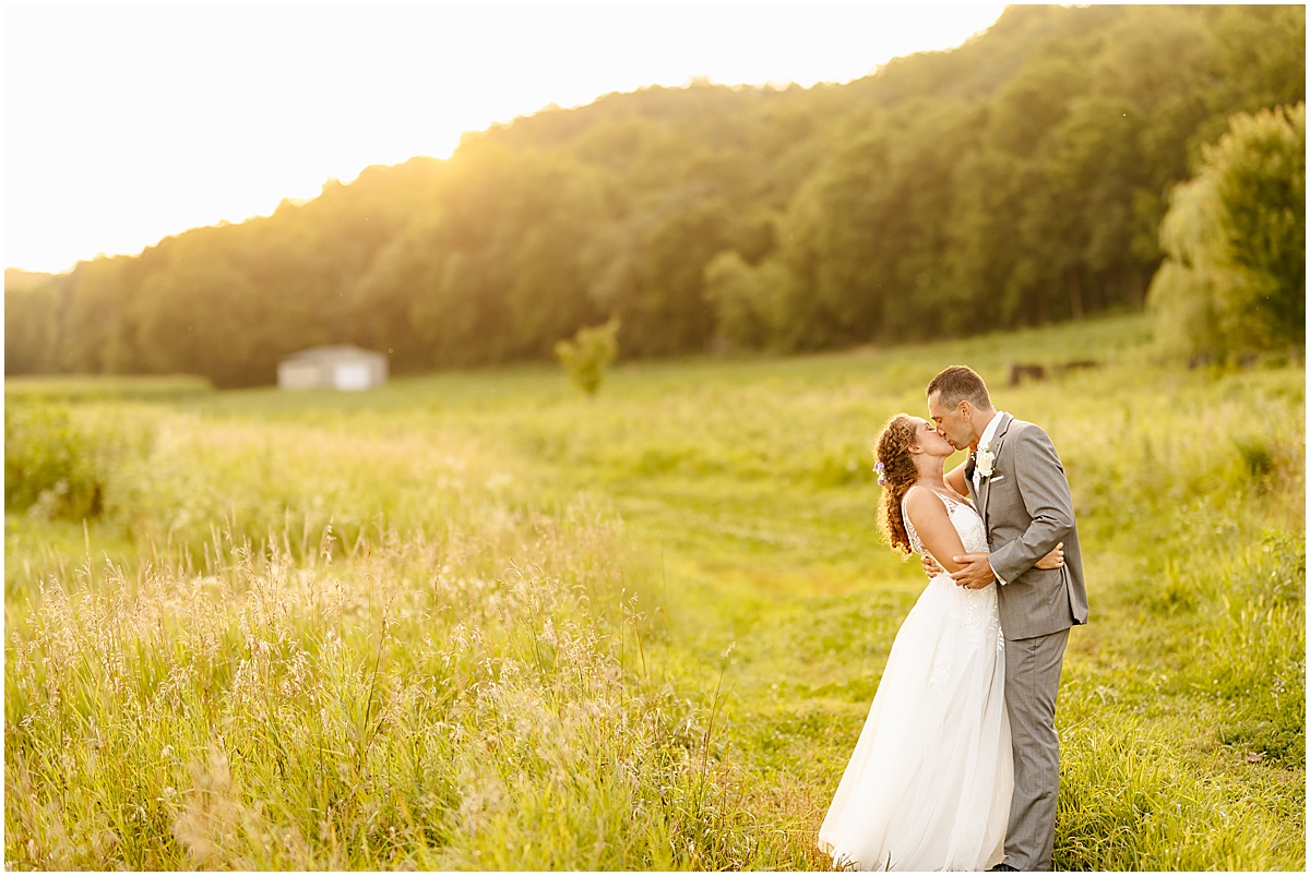 Bride and groom portraits at he Hidden Meadow & Barn wedding venue at Pepin at sunset